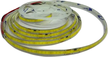 A coil of mains-voltage COB tape with a clear protective coating, its continuous warm emitter strip running along the top face