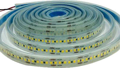 A reel of LED tape sealed inside a clear silicone sleeve, coiled so the encapsulated chips are visible through the jacket